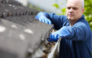 cleaning and inspecting Shop Corner roofs
